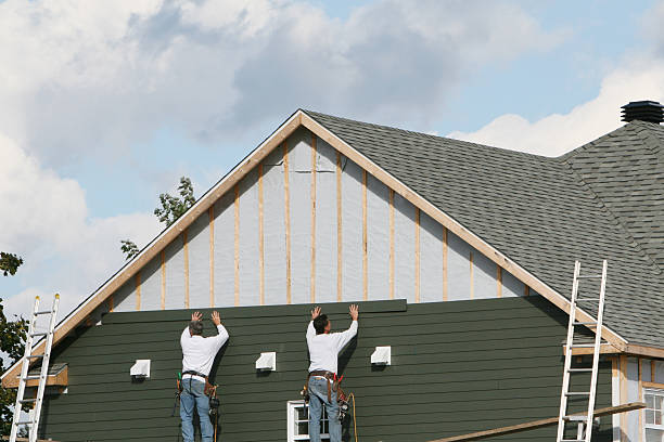 Professional Storm Damage Siding Repair technician working in Rochester, MN